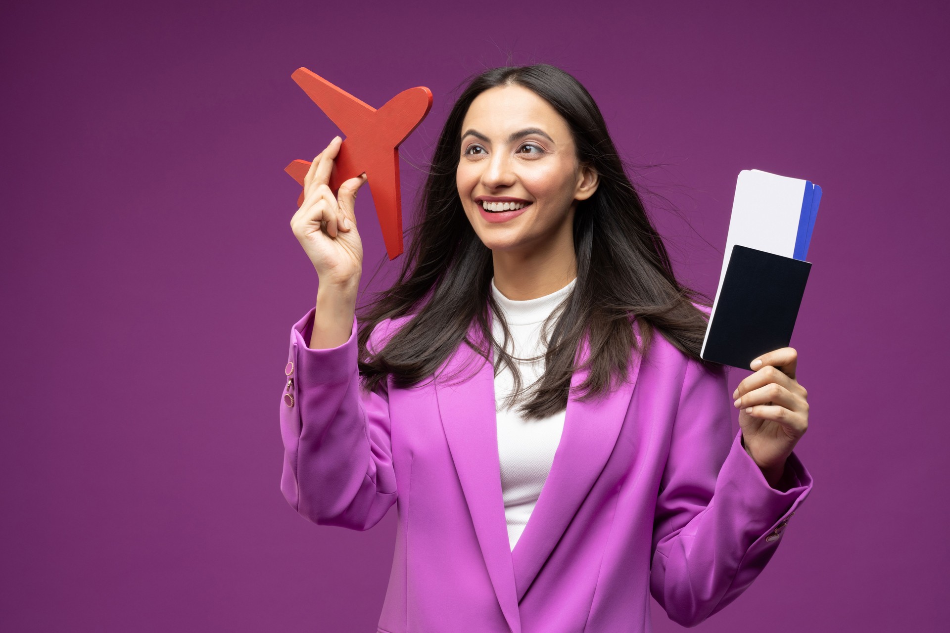 Portrait of her she nice well-dressed attractive lovely luxury pretty content cheerful girl holding in hands paper documents boarding pass departure isolated on purple background stock photo